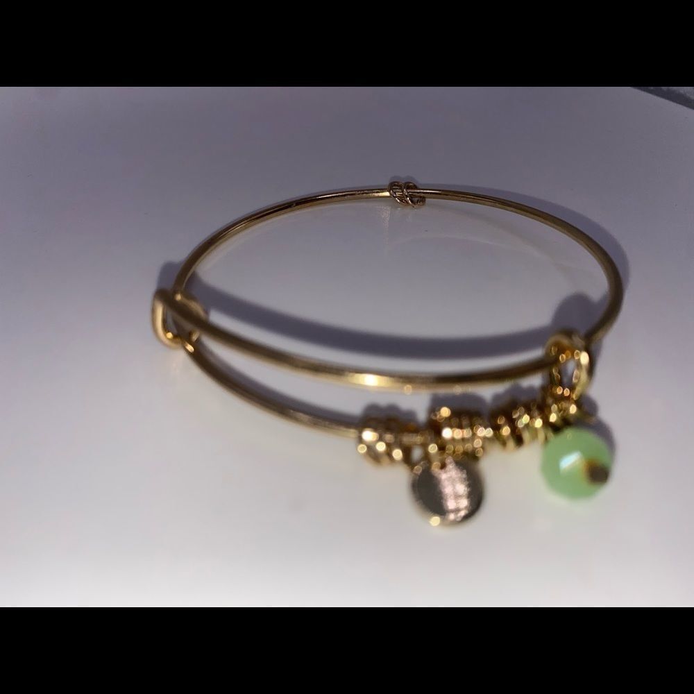 4/$20 Gold tone bangle with light green bead